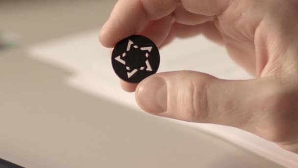 Close up view of a button from a shirt with pattern in the shape of a star — Stock Video