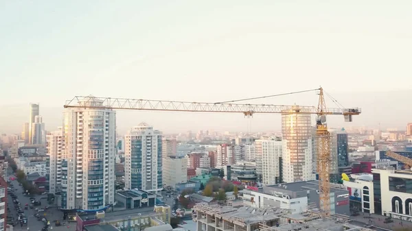 Construction in the city with a crane manipulator. Video. Top view of the construction site in the city