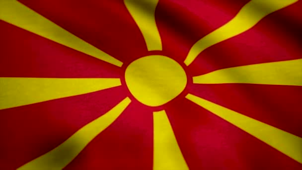 Reális zászlaja Macedónia hullámos szövet felületén. Háttérben a Macedónia volt Jugoszláv Köztársaság zászlaja — Stock videók