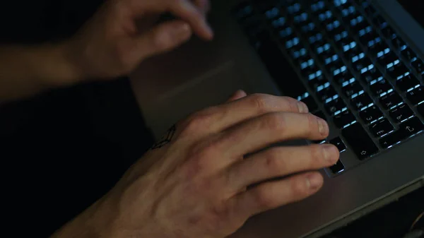 Anonymous male on a laptop at night. Stock. Concept of internet addiction. Working at laptop pc at night — Stock Photo, Image
