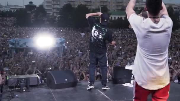 Russia - Saint Pitersburg, 10.10.2019: Famous rap band performing live hip hop music show on the stage. Action. Rappers with microphone in front of their fans — Stock Video