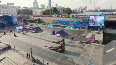 Ekaterinburg, Russia - August, 2019: Extreme performance of motorcyclists in the city. Action. An unknown freestyle motocross rider soars through the air performing high-flying stunts on a motorcycle
