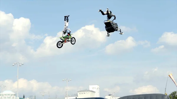 Yekaterinburg, Russia-August, 2019: Man performs on snowmobile. Action. Man on snowmobile performs stunts on sports festival. Moto freestyle with snowmobile in summer — Stock Photo, Image