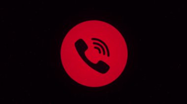 Telefon ikonu siber uzayda noktaların üzerine püskürtülür. Animasyon. Siyah arkaplanda renkli telefon simgesi
