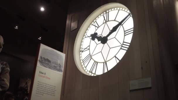 London, Britain-September, 2019: Vintage floor clock in Museum. Action. Old large clock with beautiful dials are behind window in Museum. Museum of ancient clocks — Stock Video