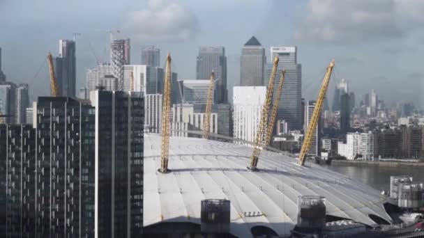 View from river Thames over millennium dome in London on cloudy sky background. Action. London, United Kingdom, high skyscrapers of the city, architecture concept. — стокове відео