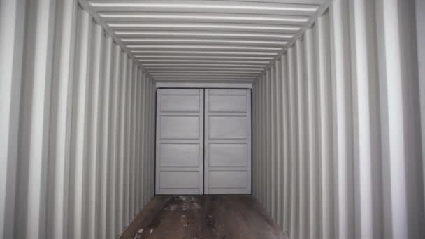 View inside of spacious empty cargo trunk of the truck with metal covering, transportation and trucking industry concept. Stock footage. Inside the metal container. — Stock Video