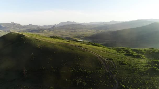 Top view of the hills with a road. Shot. Empty road on a hill in summer — 비디오