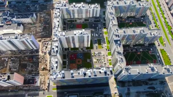 Top view of residential and construction areas. Motion. Bright contrast of dirty area under construction and new residential area located nearby — Stock Video