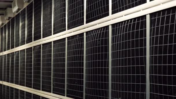 Complex equipment in data center. Stock footage. Black mesh panels for cooling data centers. Black panels are located in entire wall in room for data centers — Stock Video