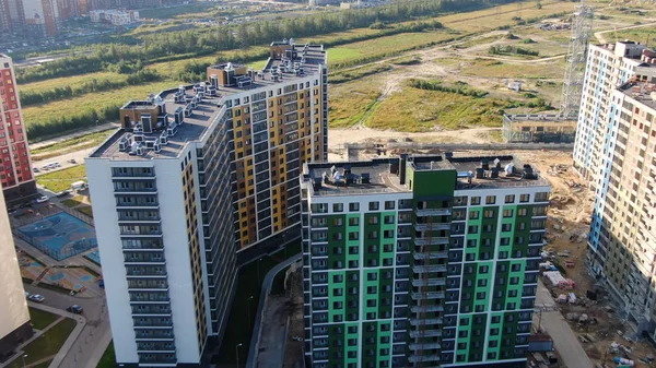 Top view of building area of residential buildings. Motion. Beautiful area with new colored high-rise buildings for residential area of modern city in summer — 스톡 사진