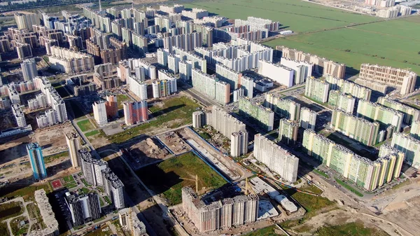 Top view of area under construction with residential high-rise. Motion. Large area with complex colored high-rise buildings under construction — 스톡 사진