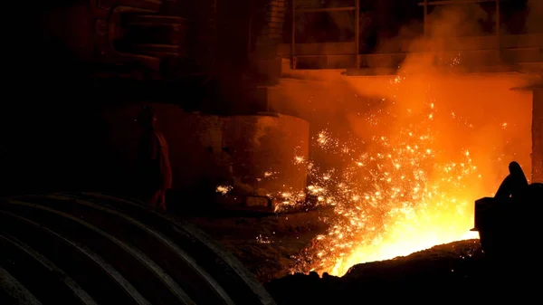 Iron and steel metallurgical plant, metallurgical production. Stock footage. Metal Melting process with many flying bright sparkles. Royalty Free Stock Photos