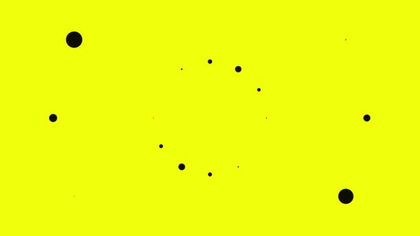 Pequeños puntos negros abstractos sobre fondo amarillo. Animación. Puntos negros de diferentes tamaños parecen explotar y divergir en diferentes direcciones — Vídeo de stock