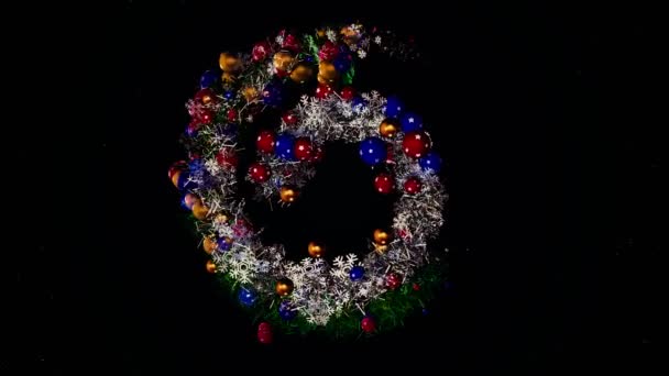 Abstract beautiful spiral, Christmas garland with toys and tinsel, seamless loop. Animation. Spinning silver and green vortex with colorful New Year tree decorations on black background. — Stock Video