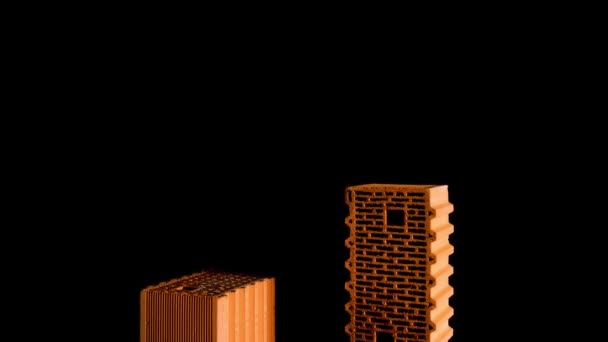 Primer plano de dos ladrillos anaranjados aislados sobre fondo negro. Imágenes de archivo. Concepto de materiales de construcción , — Vídeo de stock