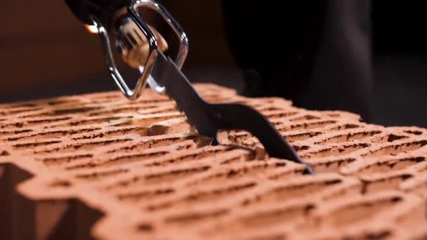 Close up of the builder saws the ceramic blocks with an automatic saw. Stock footage. Construction of new building concept. — 비디오