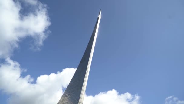 Moscow, Russia - May, 2019: View of memorial of rocket on blue sky background. Action. Beautiful famous rocket monument at cosmonautics Museum on background of sky — Stock Video