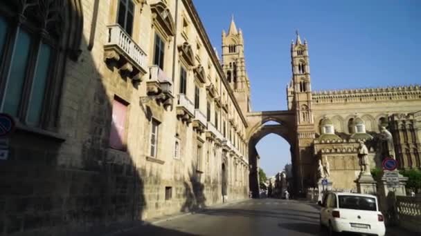 Beautiful arched passage with towers of old architectural building on background of sky. Action. Detailed architectural building with tower and vaults is european tourist attraction — Stock Video