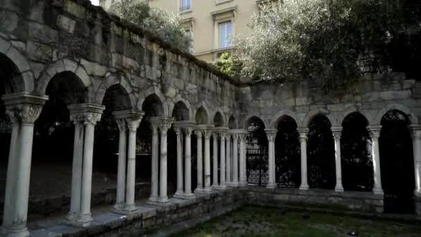 Medieval ruins with colonnade in old city. Action. Landmark in city center with abandoned ruins of monastery with galleries of columns — Stock Video