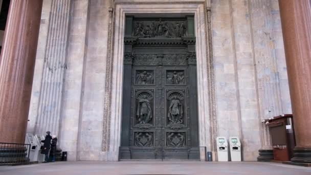 Facade of great gate to Cathedral. Concept. Beautiful high gates at entrance to historical architectural temple. Majestic black gate with patterns at entrance to european historical building of — Stockvideo