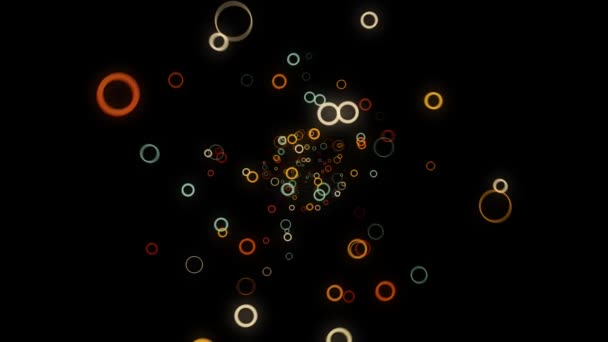 Abstract beautiful random flow of colored round forms on black background, 3D effect. Animation. Many small rings moving towards the camera. — Stock Video