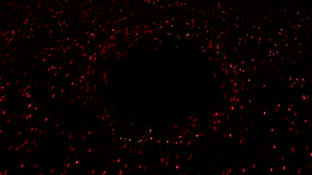 Kolorowe cząstki poruszają się na czarnym tle wokół okręgu. Animacja. Hipnotyczny efekt przezroczystej przeszkody na drodze poruszających się cząstek na czarnym tle — Wideo stockowe