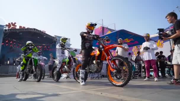 Yekaterinburg, Russia-August, 2019: Beautiful motorcyclists at city summer festival. Action. Colorful costumes and motorcycles of riders at city festival freestyle show on background of people — стокове відео