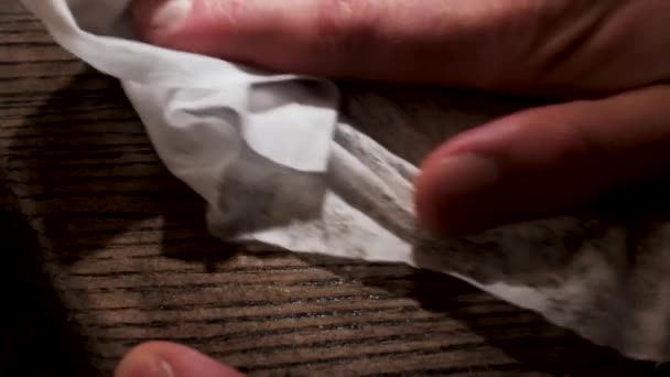 Male hand applying wood care products on a wooden bord with white cloth. Stock footage. Close up of wooden panel oiling process. — Stock Video