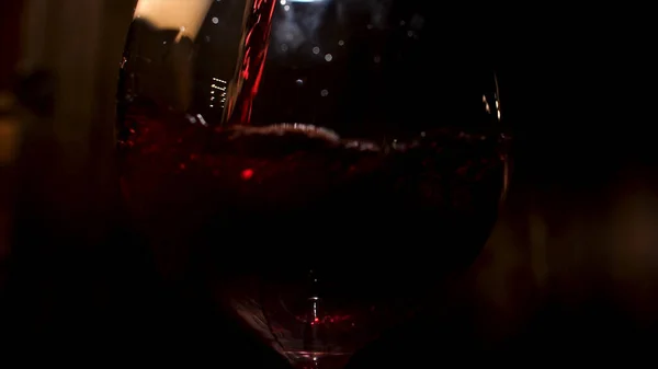 Close up of wine glass with alcoholic beverage inside. Stock footage. Wine glass with red sparkling drink poured into it. — Φωτογραφία Αρχείου