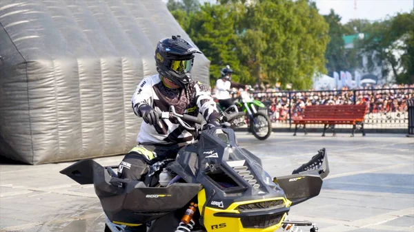 Yekaterinburg, Russia-August, 2019: Snowmobile on freestyle show. Action. Professional snowmobile rider is waiting for his appearance at freestyle show — Φωτογραφία Αρχείου