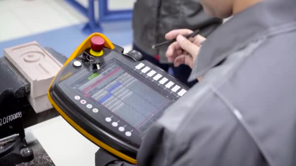 Worker uses touch control panel. Scene. Skilled worker uses electronic control panel in modern enterprise. Close-up of worker setting tasks on electronic control panel — Stock Video