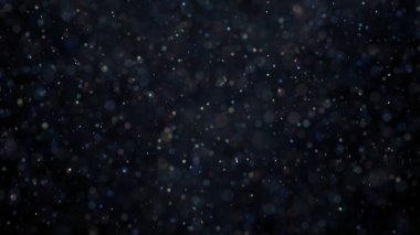 Odaklanamayan ışıldayan çok renkli sim konfetisi siyah arka plana düşüyor. Animasyon. Parti, sihir, hayal gücü, parlak bulanık ışık noktaları..