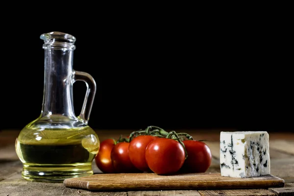 Italian tasty food, olive oil, white cheese and tomatoes.