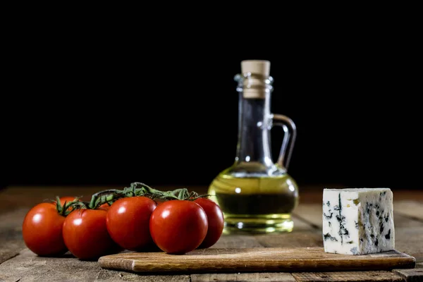 Italian tasty food, olive oil, white cheese and tomatoes.