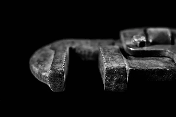 Rusty, old workshop keys. Hydraulic keys on a black table in a w