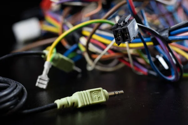 Old entangled cables, electronics and old cable connectors on a