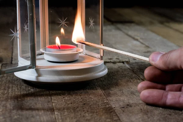 Two small lanterns on a wooden table. Candle in old latarence. W — Stock Photo, Image