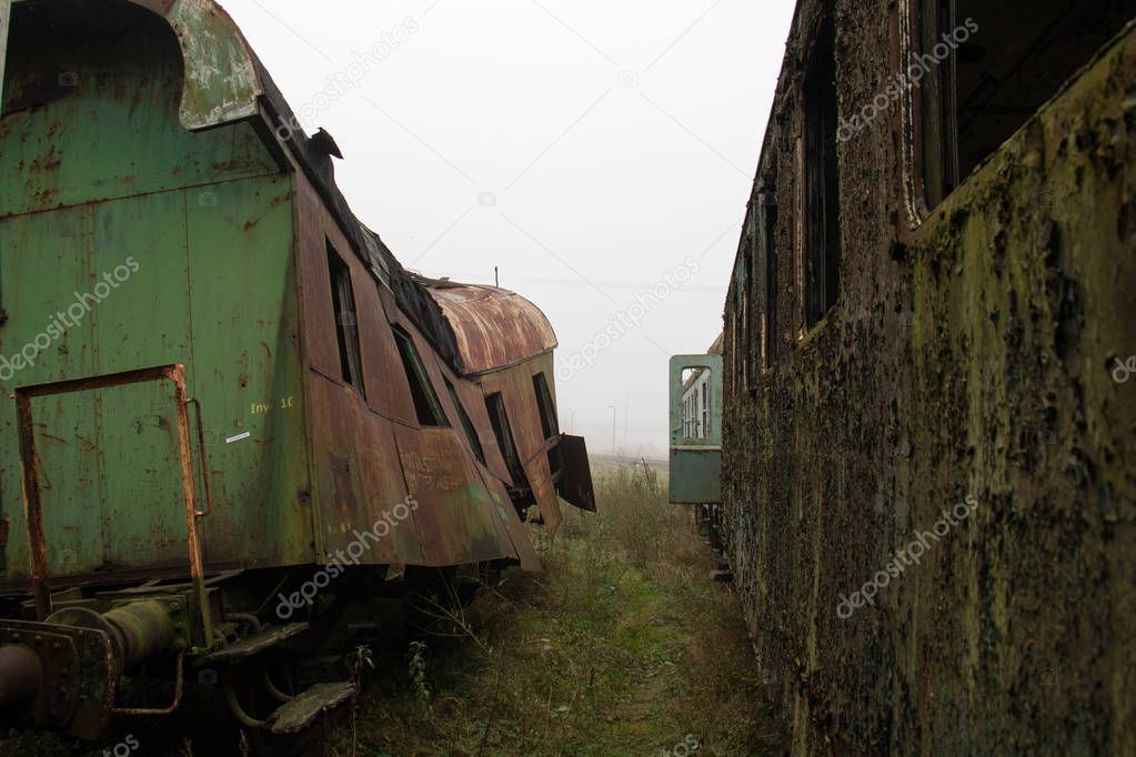 Old rusty trains. Old abandoned track, siding with dirty old tra