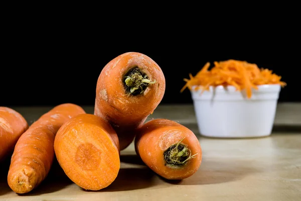 Carrot on the kitchen table. Vegetable grater. Kitchen table. — Stock Photo, Image