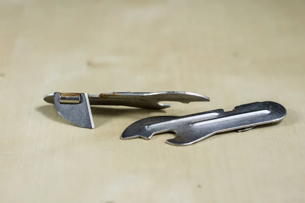 Simple metal plate opener on the countertop in the restaurant. A — Stock Photo, Image