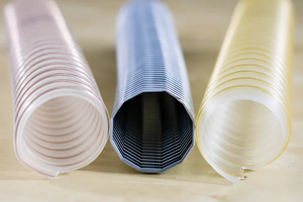 Technical hoses on a wooden table. Cables for use in factories a