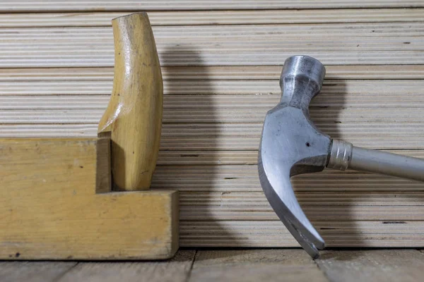 Carpentry tools on a wooden table in an old carpentry workshop.