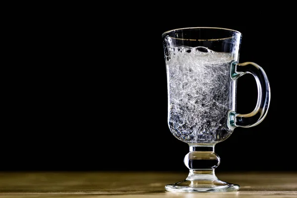 Carbonated drink in a glass bowl. Cool drink with bubbles and le