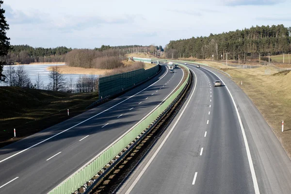 The high-speed road seen from the viaduct. Two-lane road and car