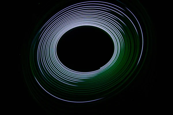 Painting with light coming from the diode. A spiral outline draw — Stock Photo, Image