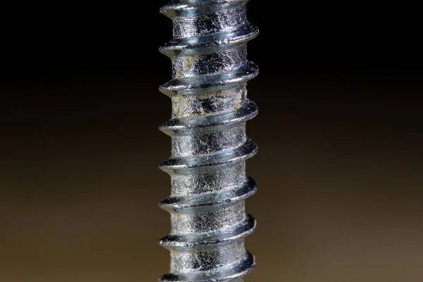 Bolts and screws for metal on a workshop table. Joinery accessor — Stock Photo, Image