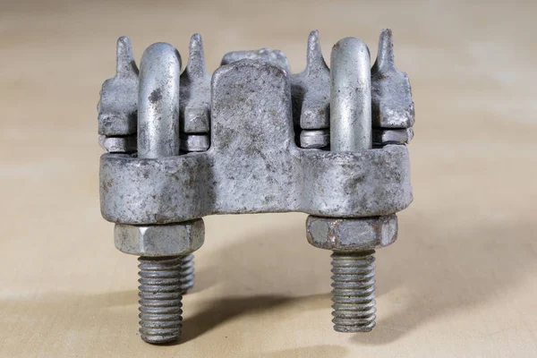 Old garden accessories. Rusty hose clamps on the workshop table.