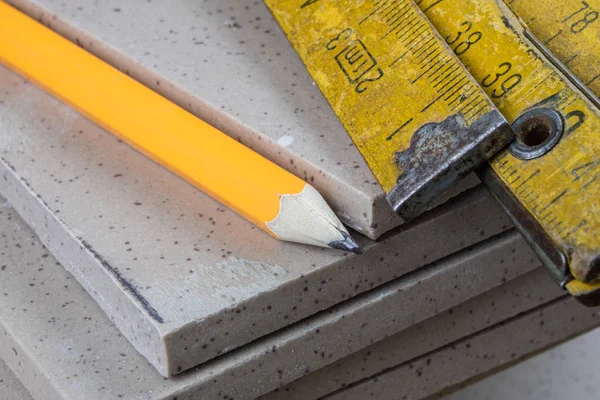 Laying and cutting tiles. Tools and building materials at a work