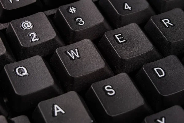 Zvětšený počítačová klávesnice. Černá klávesnice tlačítka pro co — Stock fotografie
